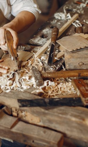 handsome-carpenter-working-with-a-wood-e1623128999508.jpg