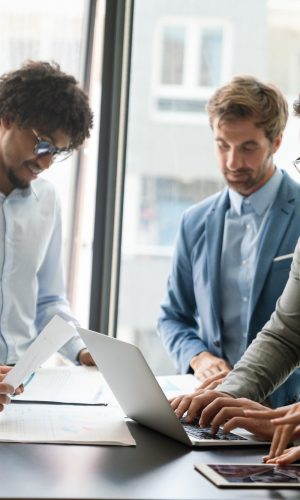 portrait-of-successful-business-team-working-in-office-1.jpg